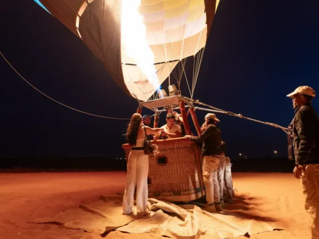Desert camp fire show at night