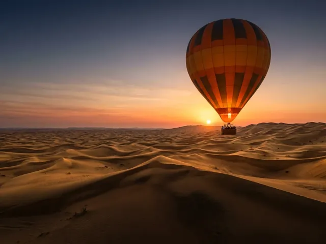 Hot air balloon over the Dubai desert at sunrise